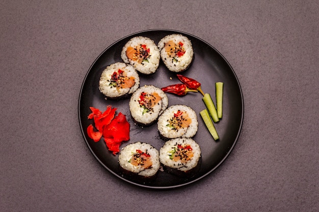 Korean roll Gimbap(kimbob). Steamed white rice (bap) and various other ingredients. Trendy black background