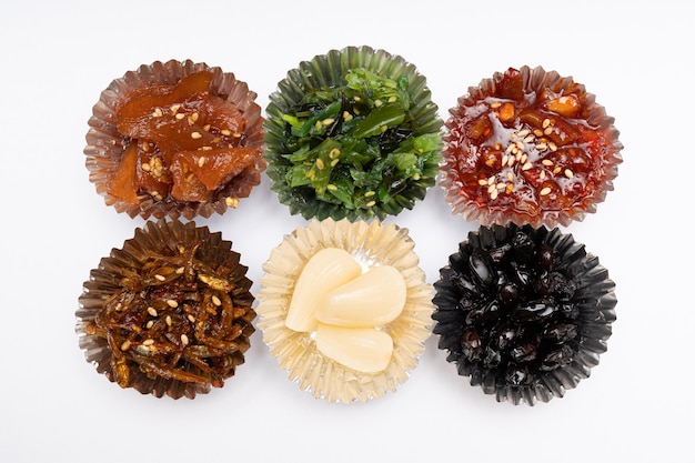 Korean side dishes in a delicious-looking silver foil case