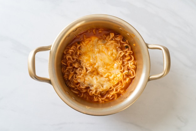 Korean spicy instant noodle bowl with mozzarella cheese