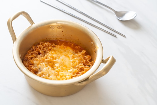 Korean spicy instant noodle bowl with mozzarella cheese