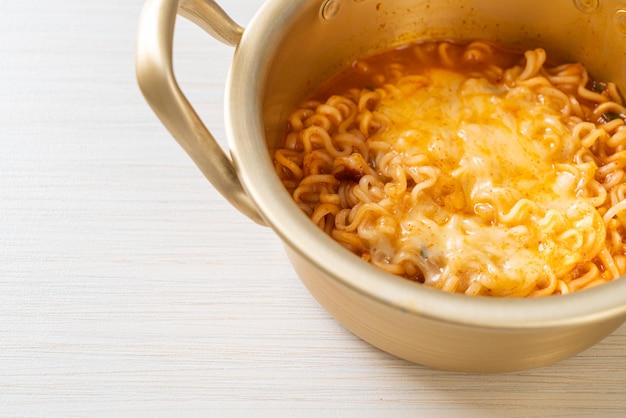 Korean spicy instant noodle bowl with mozzarella cheese