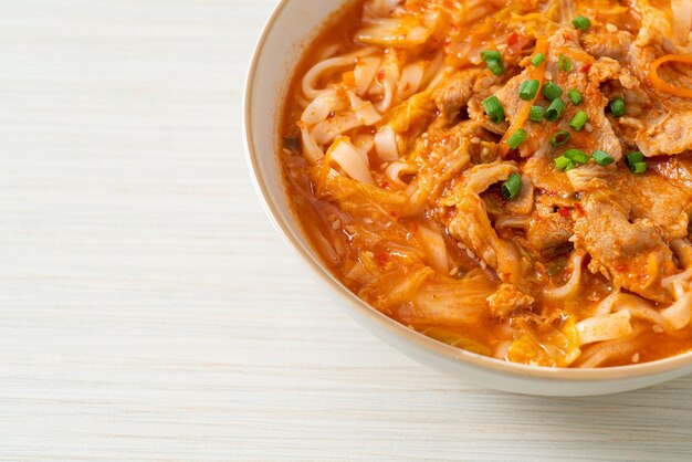 Korean udon ramen noodles with pork in kimchi soup