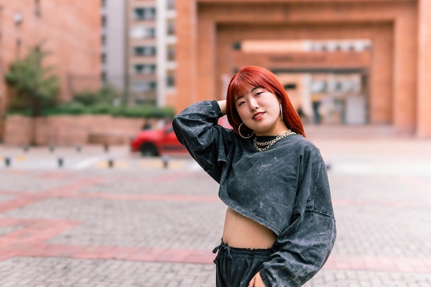 Korean Woman with Bold Red Hair in Urban Area