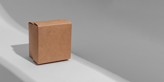 Kraft carton box cover of square shape cardboard package Banner background