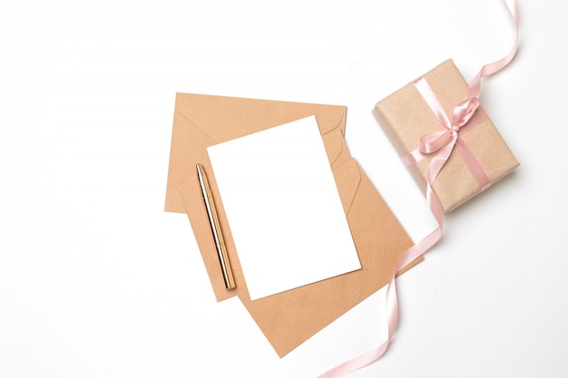 Kraft paper envelope with blank sheet and surprise gift box