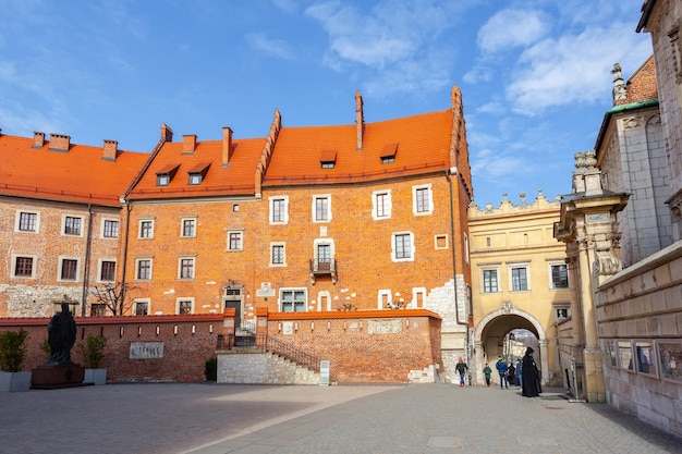 Krakow Poland 14 March 2022 Tourists walking inside the Wawel Castle yard