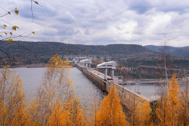 Krasnoyarsk hydroelectric power plant top view in autumn Reservoir and water discharge mines