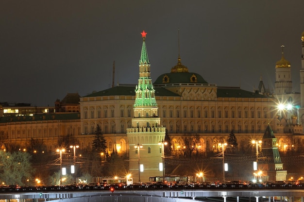 The kremlin building at night with a red star on top