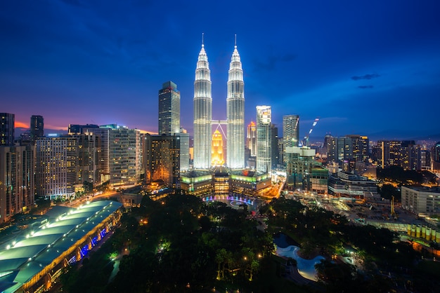 Kuala Lumpur city skyscraper and green space park with nice sky sunset