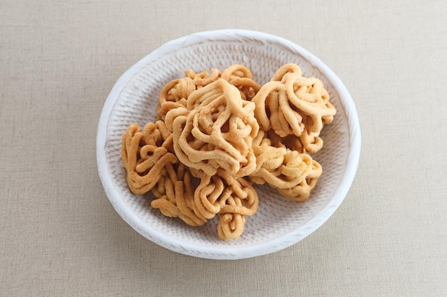 Kue Akar Kelapa or Unthuk Yuyu Javanese traditional snack made from glutinous rice flour