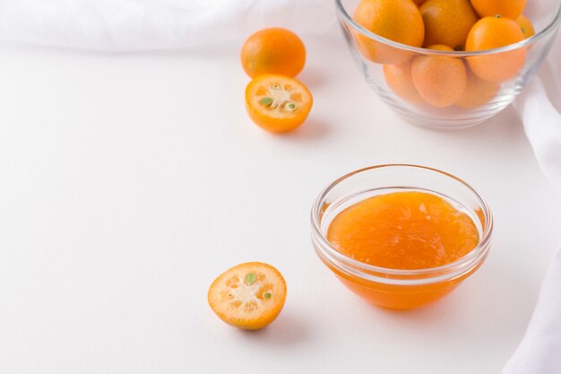 Kumquat jam near kumquat fruits