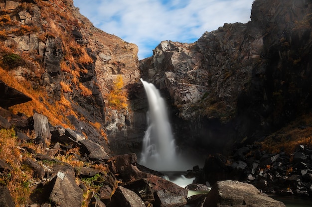 Kurkure waterfall in Altai mountains in autumn, Altai Republic, Siberia, Russia. Long exposure shoot