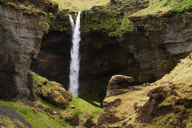 Kvernufoss waterfall in a mountain gorge. The amazing nature of Iceland