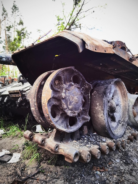 Kyiv region Ukraine May 15 2022 War in Ukraine Highway Kyiv Zhytomyr People take selfies against destroyed russian tank after russian atack in Febrary