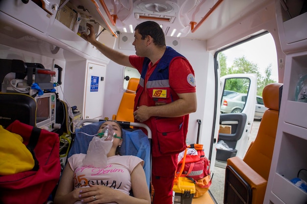 Kyiv Ukraine 2062022 An ambulance paramedic treats the girl