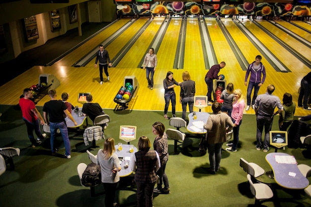 Kyiv, Ukraine - 25 November 2018 Friends have fun while bowling and spend time together.