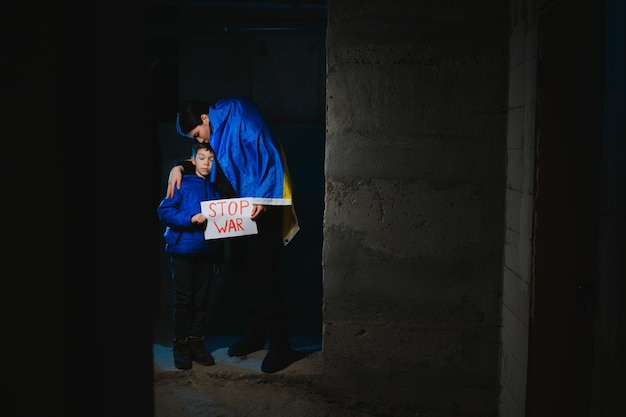 KYIV UKRAINE Mar 21 2022 War in Ukraine Life in a bomb shelter Young mother with a child in a bomb shelter