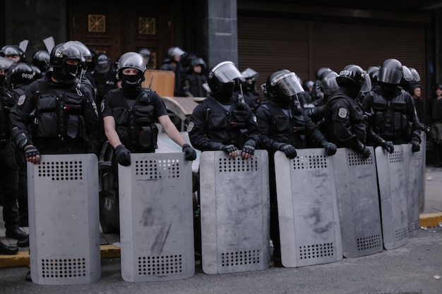 Kyiv, Ukraine, September 18, 2018 Protesters storm a public facility. Policemen with riot shields.