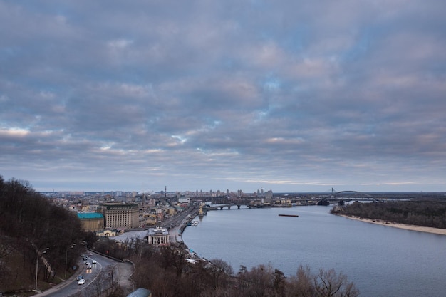 Kyiv, winter morning, beautiful view to the historical center Podol. Dnipro river, cloudy sky.