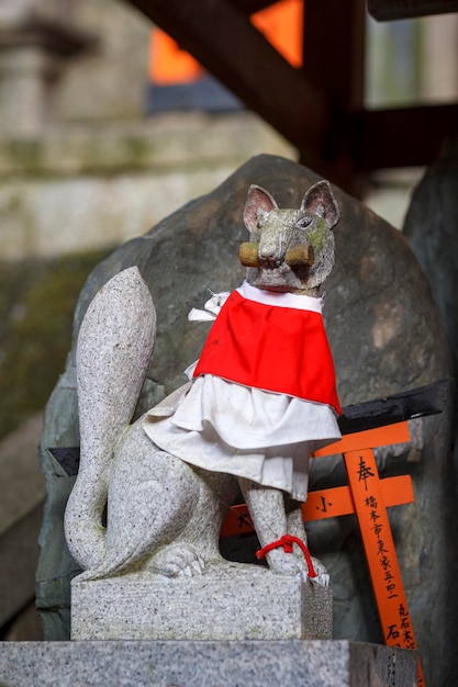 KYOTO JAPAN February 24 2014 Stone Fox or Kitsune Statue at Fushimi Inari Taisha Shrine in Kyoto Japan