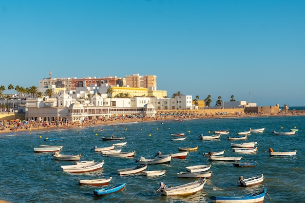 La Caleta beach full of tourism in the summer sunset of the city of Cadiz Andalusia