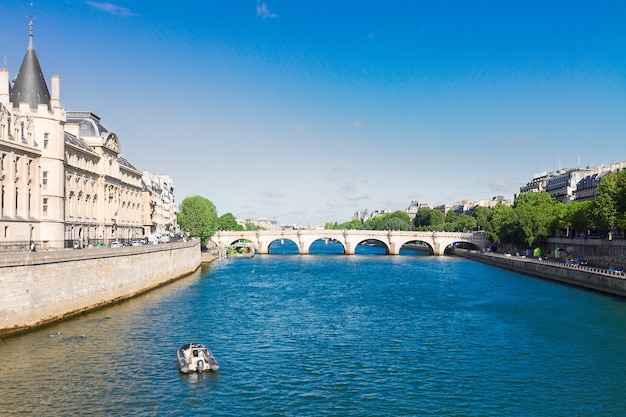 La Conciergerie  and Pont Neuf and river Seine at sunny summer day, Paris, France