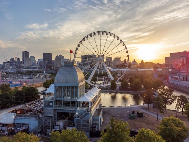 La Grande roue de Montreal Ferris wheel and downtown skyline in summer dusk Quebec Canada