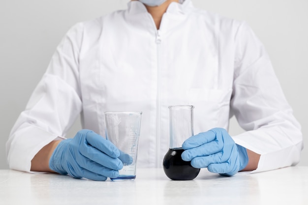 Lab doctor performing medical exam of urine