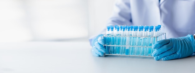 Lab practitioner working on chemical research for chemical reactions does a chemical experiment and examines a patient's blood sample Medicine and research concept