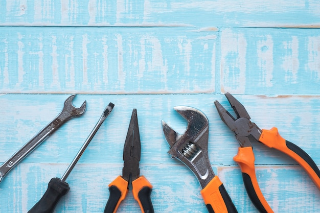  Labor day Concept. Construction tools on blue wooden surface.