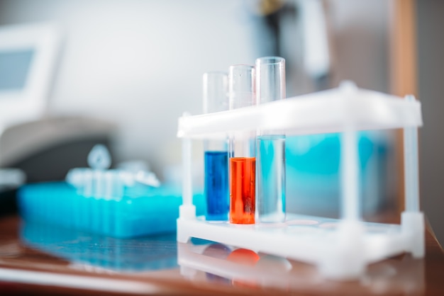 Laboratory tests in glass flasks closeup. Chemical reagents in medical lab