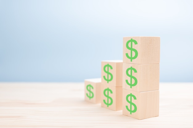 Ladder made of wooden blocks with dollars