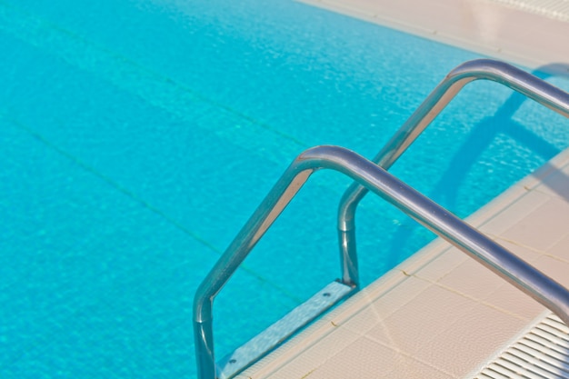 Ladder of a swimming pool. Horizontal shot