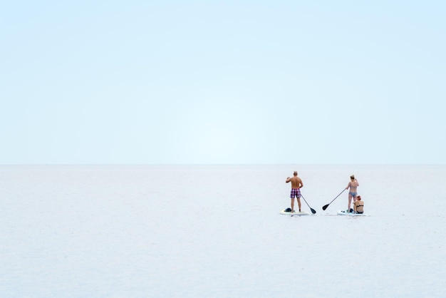 Ladoga lake Russia 2022 August 12 Standing with a paddle on a floating board