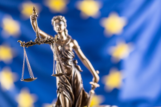 Lady Justice and European Union flag. Symbol of law and justice with EU Flag.