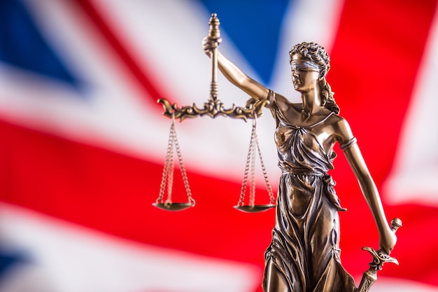 Lady Justice and United Kingdom flag. Symbol of law and justice with UK Flag. Brexit.