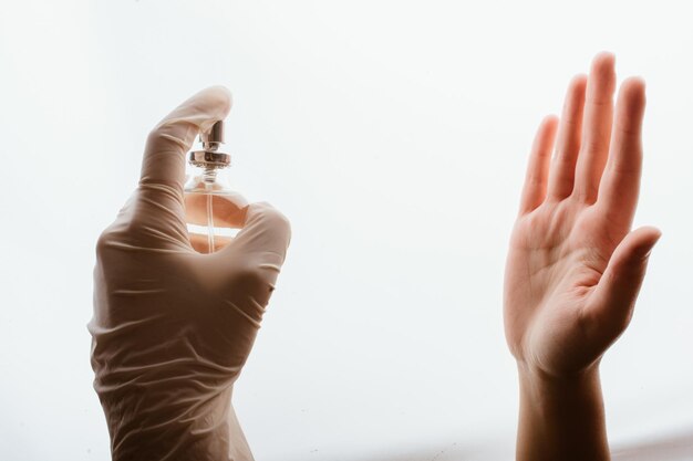 Ladys hand takes disinfectant spray to prevent a viral pandemic