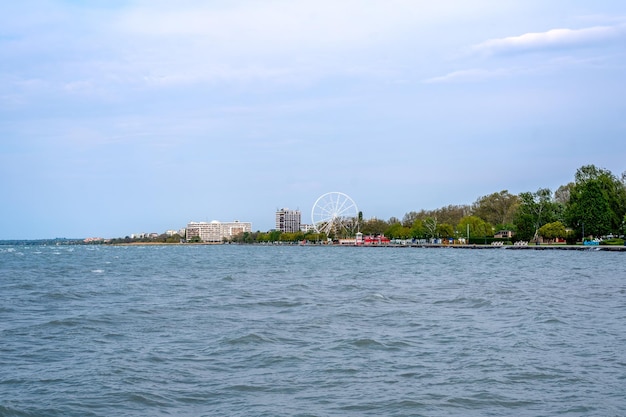 Lake Balaton in spring sunshine view of Ferris wheel from Balaton beach