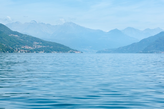 Lake Como (Italy) summer coast hazy view from ship board