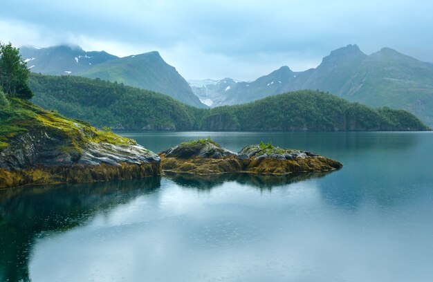 Lake (fjord) and rainy view to Svartisen Glacier