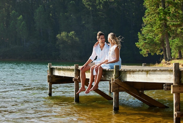 Lake love and couple on vacation summer and break for quality time bonding and loving together Romance man and woman in nature forest and romantic getaway for rest relationship and happiness