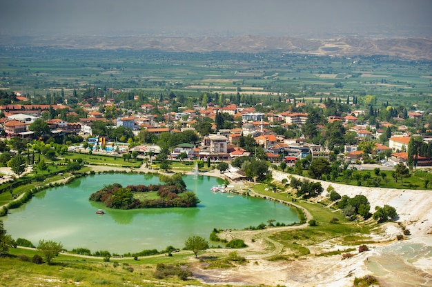 Lake and natural carbonate formations on a mountain in Pamukkale, Turkey