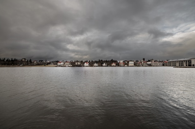 Lake of Reykjavik, Iceland in the center of the city a cloudy dark day. 