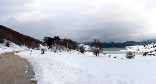 Lake of the springs of Aoos in the mountains Epirus region Greece in winter on a cloudy day