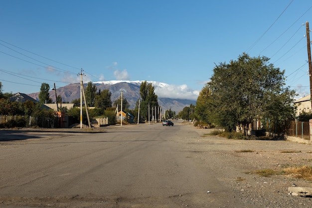 Lake street balykchy town kyrgyzstan a town on the shore of issyk kul lake street view in