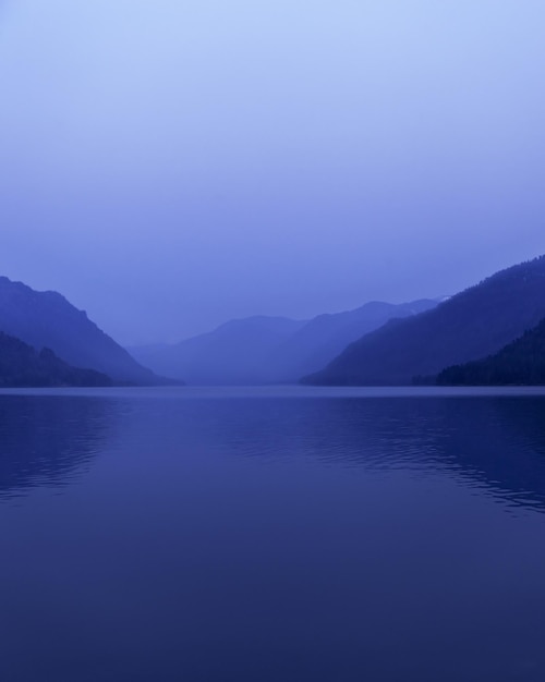 Lake Teletskoye Altai Republic Russia Blue clear sky and Mirror of lake Abstract panoramic landscape