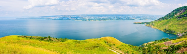 Lake Toba and Samosir Island view from above Sumatra Indonesia. Huge volcanic caldera covered by water, green landscape