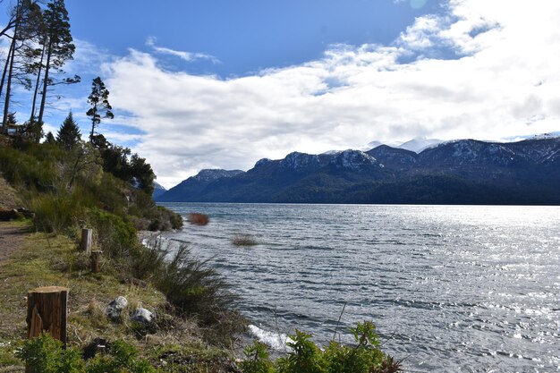 a lake with mountains in the background