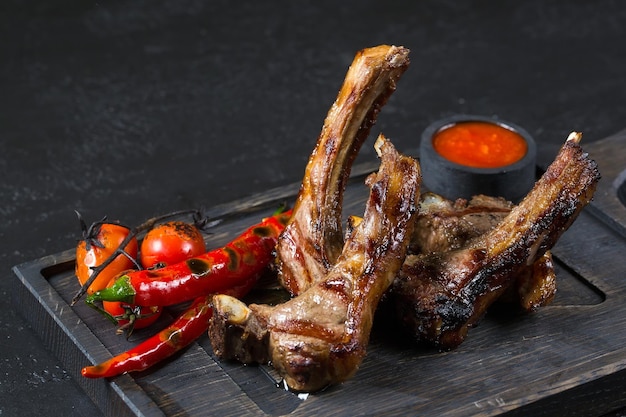 Lamb square with hot pepper on a wooden board