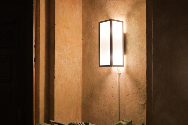 A lamp in home against white wall